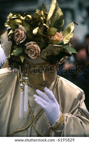 Venetian disguise with golden mask, gloves and headdress with roses