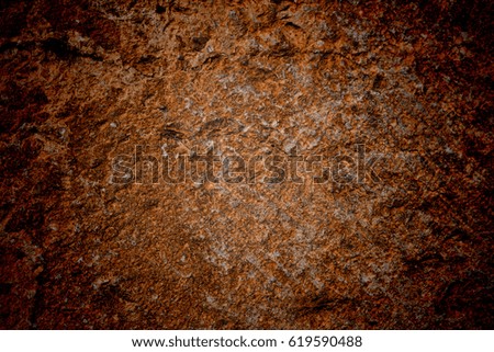 Vignetted stone wall background with lots of texture