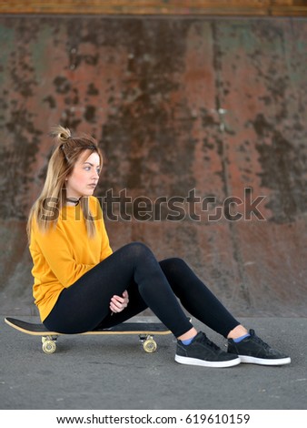 beautiful girl with skateboard