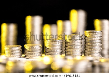 Stacks of coins with shallow depth of field as a symbol of business and banking.