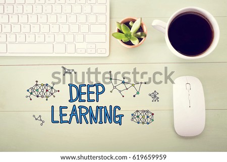 Deep Learning concept with workstation on a light green wooden desk