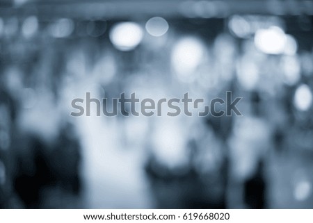 Abstract blur shopping mall interior and retail store for background in blue color
