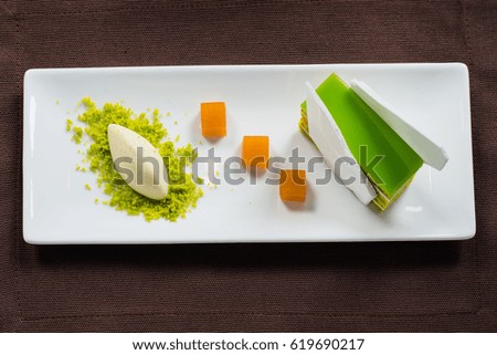 pistachio sweet dessert green jelly on white square plate