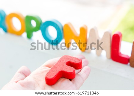 focus wooden letters F and  letter background