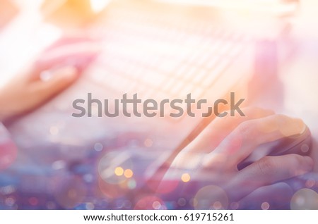 Woman hand using keyboard notebook double exposure blur bokeh city abstract background. Technology business and travel adventure concept. Shallow depth of field. Vintage tone filter effect color style