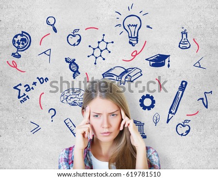 Pensive young european woman on concrete background with education doodles. School concept