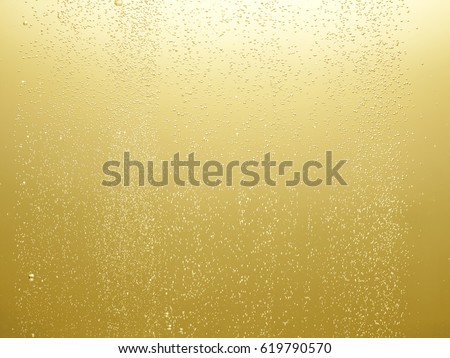Air bubbles of champagne Royalty-Free Stock Photo #619790570