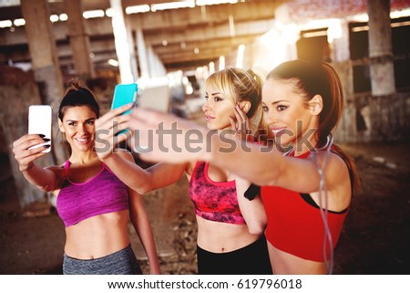Attractive females taking photo after hard work training.