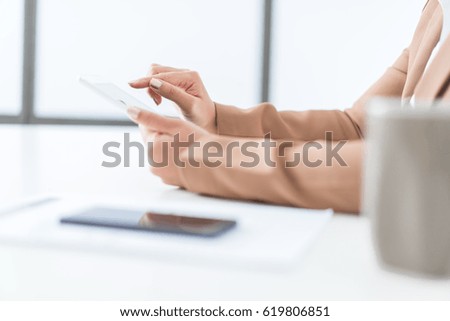 Close-up of businesswoman working with digital tablet