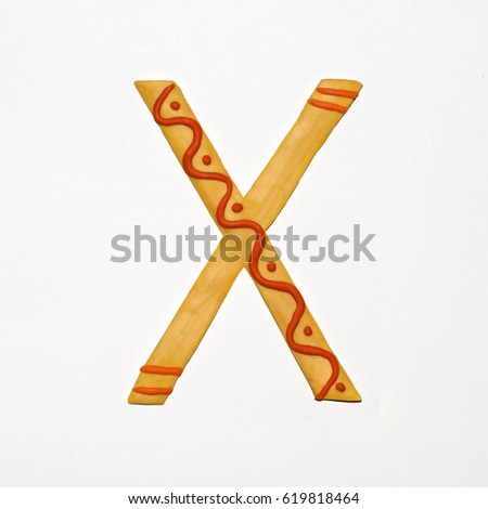 Colorful font fashioned from clay. Letter "X". Isolated letter on a white background.