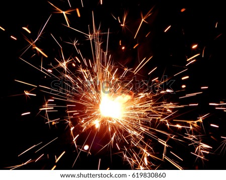 New Year Bengal lights on a black background Royalty-Free Stock Photo #619830860