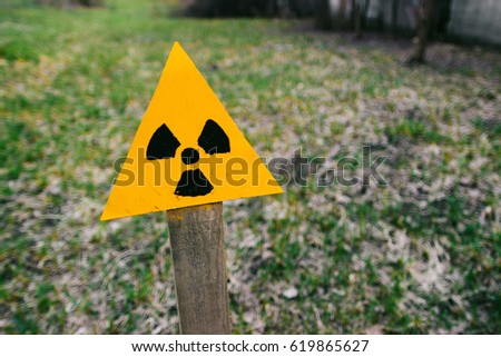 Chernobyl, a sign of radiation in the field in the spring Royalty-Free Stock Photo #619865627