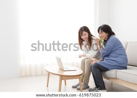 Parents and children using a laptop computer, mother, daughter, smile 