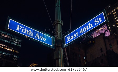 Street sign of Fifth Ave and East 41St with skylines in background.- New York, USA