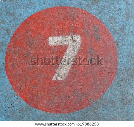 The number seven painted on a concrete