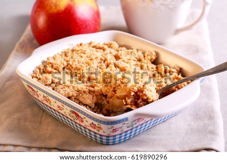 Apple crumble cake in a tin, selective focus Royalty-Free Stock Photo #619890296