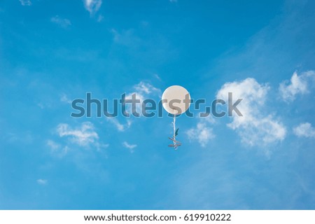 Big white balloon in the blue sky