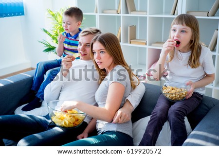 Family watching a film