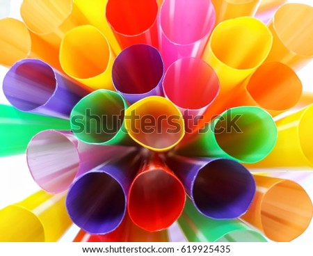 Closeup top view of colorful straws, selective focus.