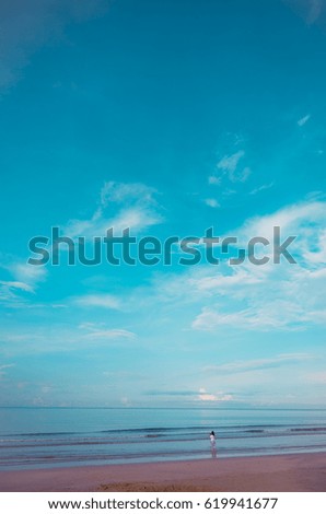 vintage tone minimalist style image of people at the sea on day time for background usage.(vertical)