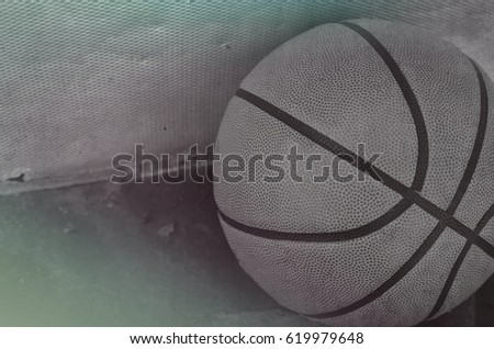 Texture shown on black and white image of rubber basketball.  The ball has vintage feel of playing a fun game of hoops with the team.