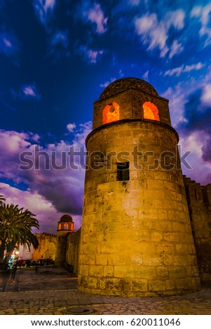Night photo of Mosque in Sousse. Medieval architecture in night lights. Vivid picture of ancient religious building - one of the main attractions in Sousse, Tunisia.