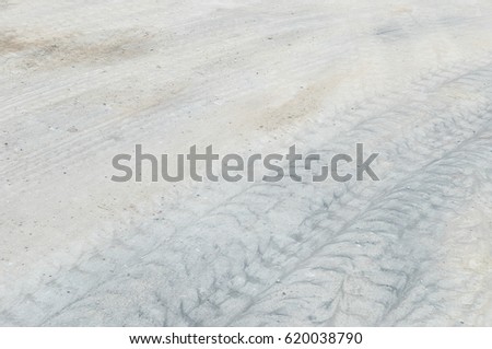Closeup surface concrete floor with tire tracks textured background