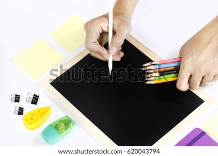 Writing on blackboard with a white pencil