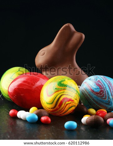 Sugar rabbit and easter eggs on stone grey