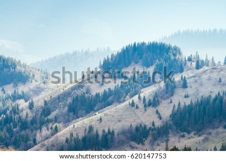 Foggy hills and gloomy mood of the scene of the alpine valley. Location place Carpathian Ukraine, Europe. Wonderful springtime wallpaper. Outdoor activity. Explore the world's beauty and wildlife.