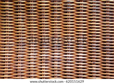 Wicker wooden background. Rattan woven top view closeup. Rattan chair interlace of natural material. Ecologic craft. Golden basketry furniture. Asian handcraft banner template picture. Tradition weave