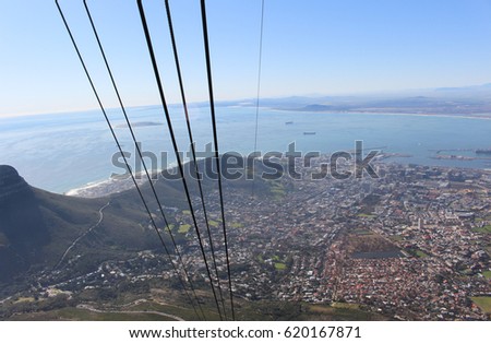 View of Cape Town city from Table Mountain cable-car including views of Lion's head, Robben Island and Atlantic Ocean. 