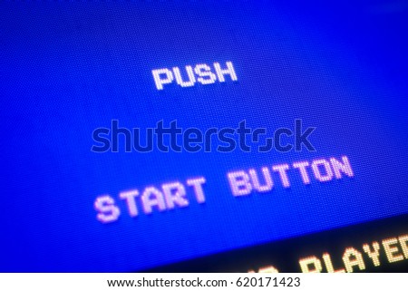 Detail Macro of an old vintage video game screen with text Push start button