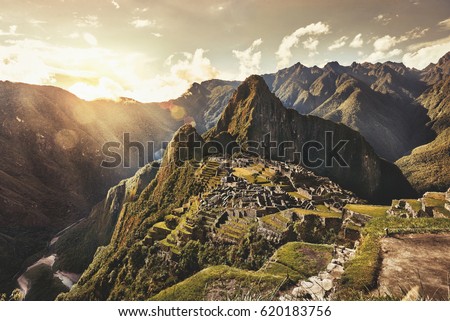 MACHU PICCHU, PERU - MAY 31, 2015: View of the ancient Inca City of Machu Picchu. The 15-th century Inca site.'Lost city of the Incas'. Ruins of the Machu Picchu sanctuary. UNESCO World Heritage site. Royalty-Free Stock Photo #620183756