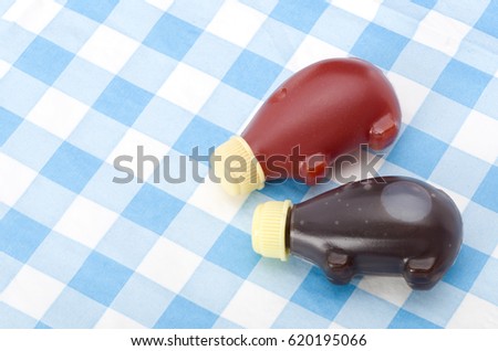 Small plastic bottle soy sauce and ketchup