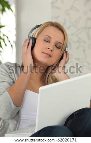 Portrait of a young woman relaxing listening to music