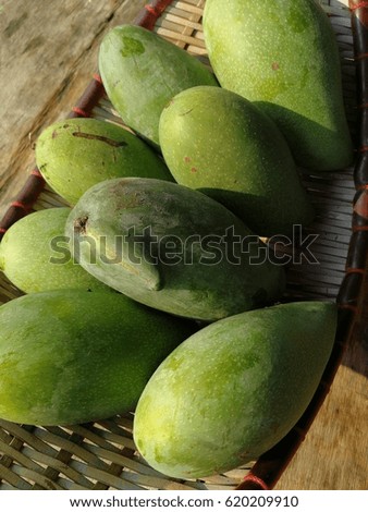 fresh green mango on wooden table, healthy fruit