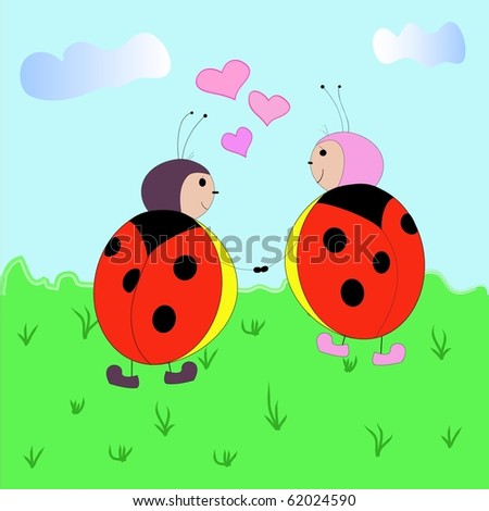 Enamoured ladybirds in the grass