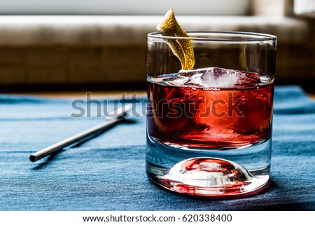 Negroni Cocktail with lemon peel and ice (Americano)