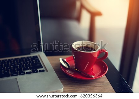 laptop and black coffe in vintage tone