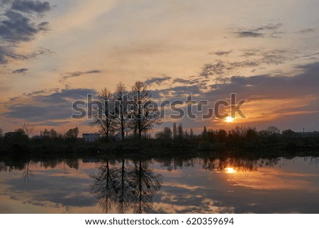 Sky and clouds on sunset on water.                               