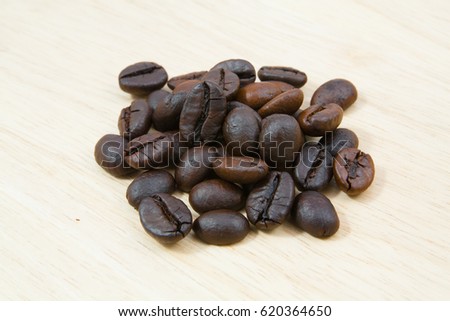 coffee beans in closeup on wood  background