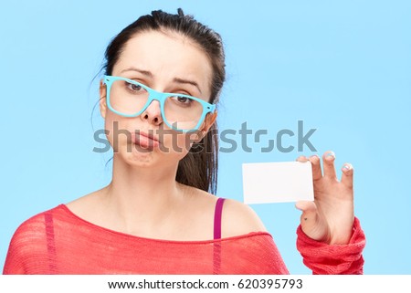       woman in glasess with business card                          portrait sad upset