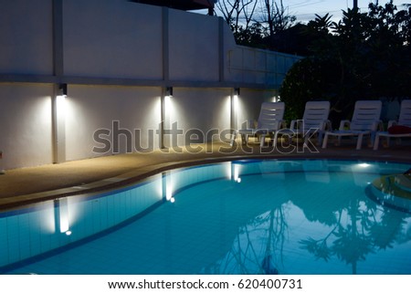 Modern swimming pool at night