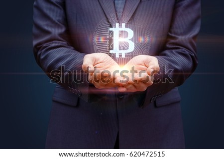 Business man with hands offers bitcoin concept design.