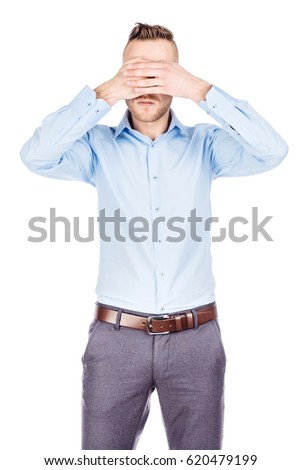 businessman covering his eyes with his hand. emotions, facial expressions, feelings, body language, signs. image on a white studio background.
