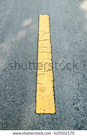 Asphalt road with yellow line sign.selective focus for background texture.