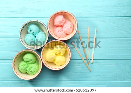 Ice cream collection in bowls on wooden background