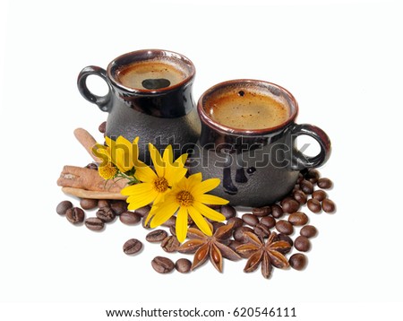 espresso coffee in handmade kraft vintage ceramic cups and grains of black coffee, cinnamon, anise ang bright yellow daisy flowers, isolated on white background.