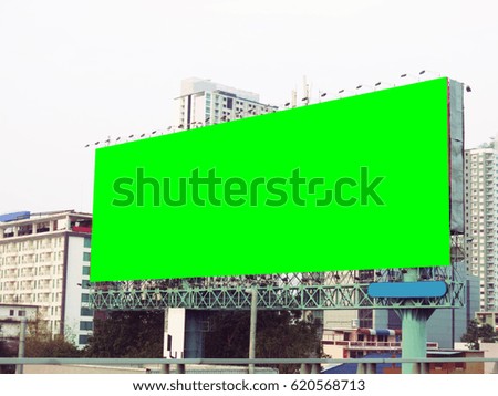 Green color screen billboard in city